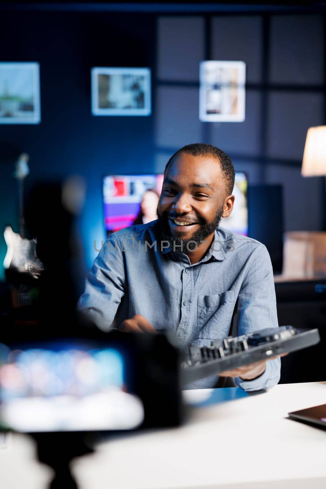 Content creator excited to do giveaway for social media followers, offering DJ controller device to most loyal fan. Media star happy to gift fanbase professional disc jockey turntables as prize