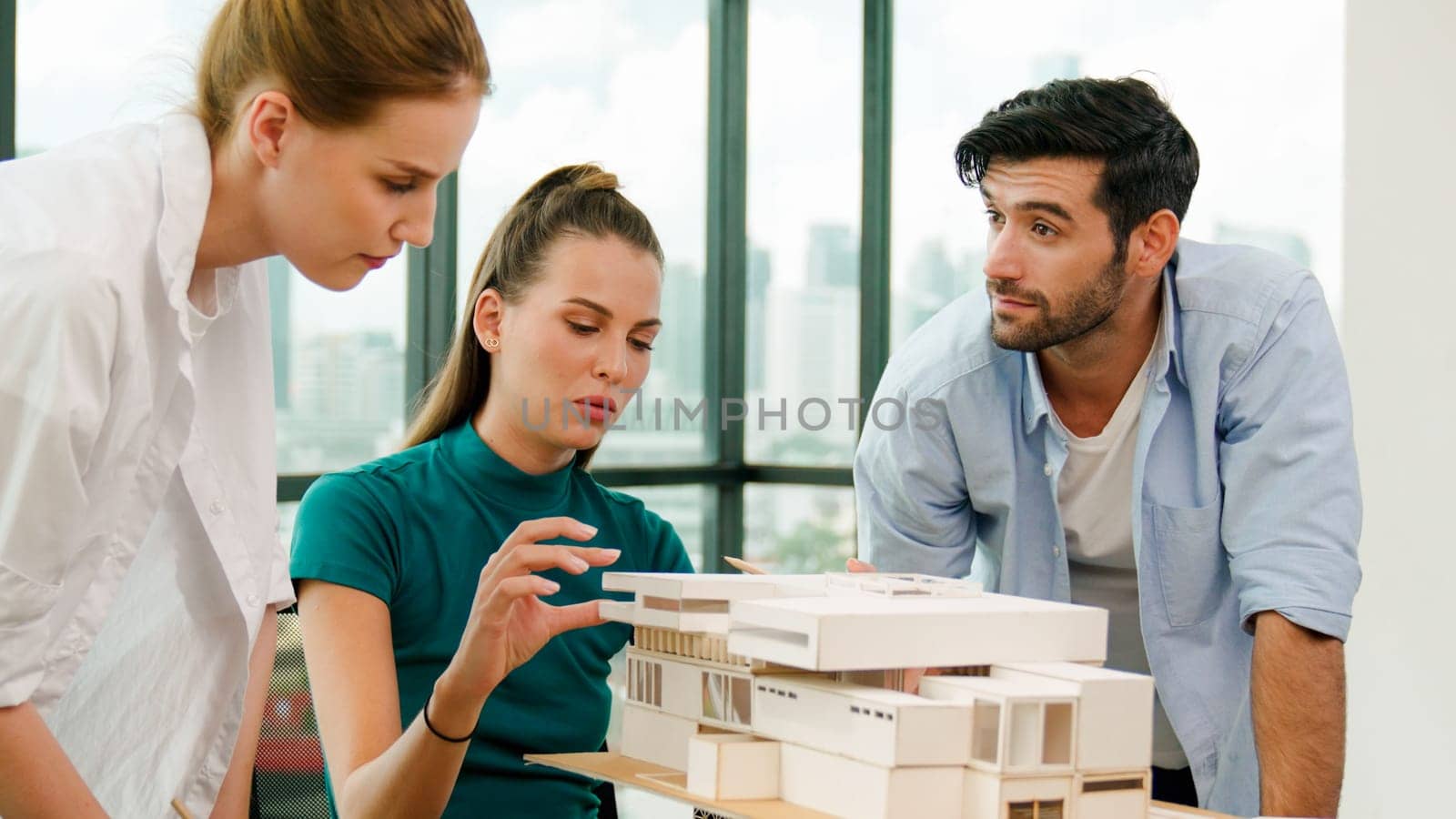 Smart architect team discussion about house design while handsome male worker present idea by using laptop. Group of professional engineer sharing, brainstorming design. Business design. Tracery