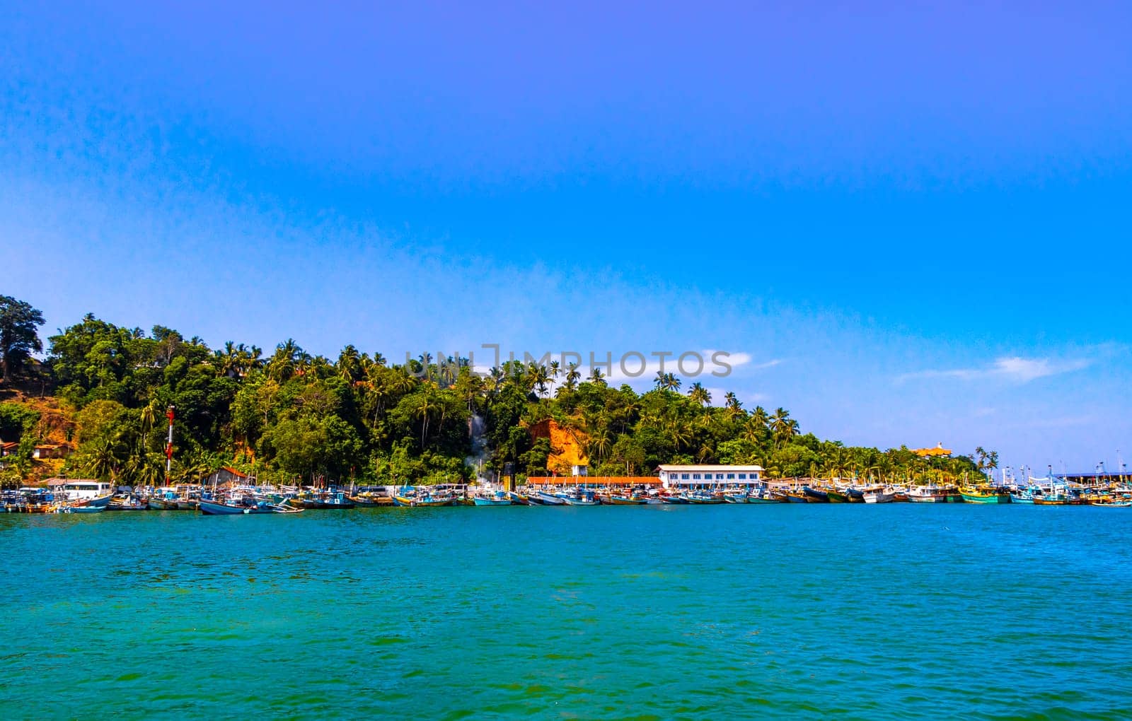 Mirissa Beach Southern Province Sri Lanka 19. March 2018 Mirissa Fisheries Harbor with boat boats ships catamaran to blue whale tour in Mirissa Beach Matara District Southern Province Sri Lanka.