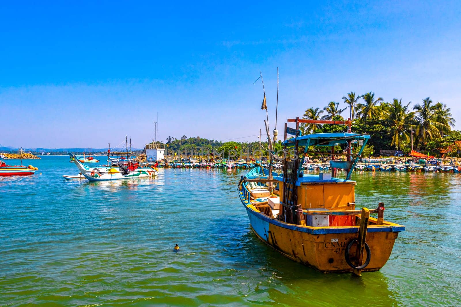 Mirissa Beach Southern Province Sri Lanka 19. March 2018 Mirissa Fisheries Harbor with boat boats ships catamaran to blue whale tour in Mirissa Beach Matara District Southern Province Sri Lanka.