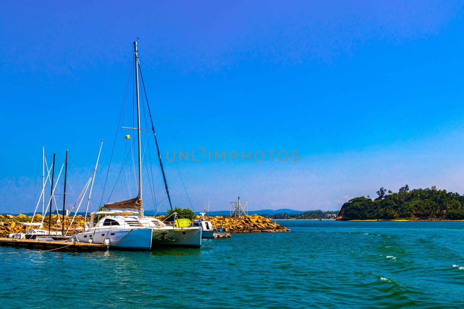 Mirissa Beach Southern Province Sri Lanka 19. March 2018 Mirissa Fisheries Harbor with boat boats ships catamaran to blue whale tour in Mirissa Beach Matara District Southern Province Sri Lanka.