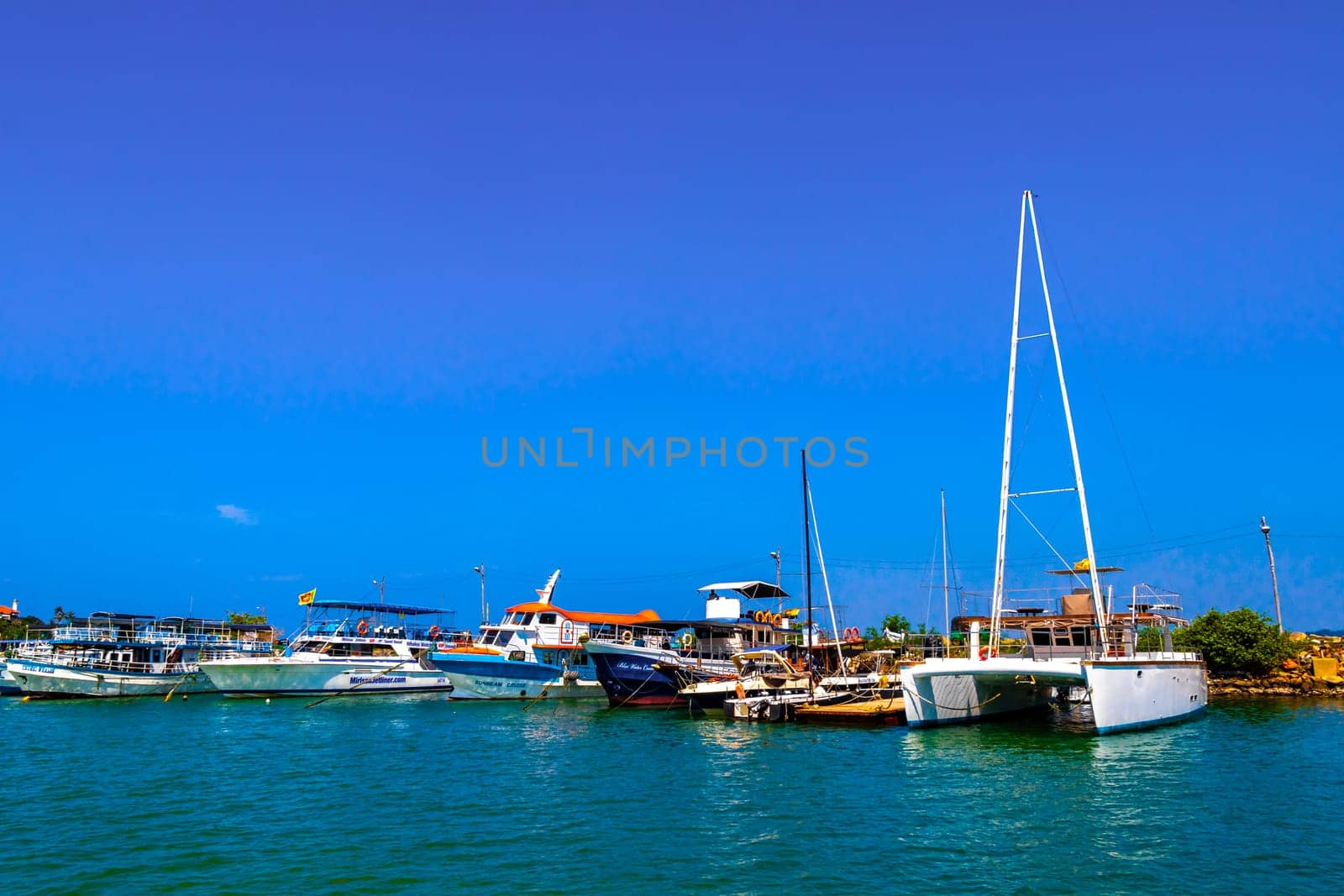 Mirissa Fisheries Harbor with boat boats ships catamaran Sri Lanka. by Arkadij