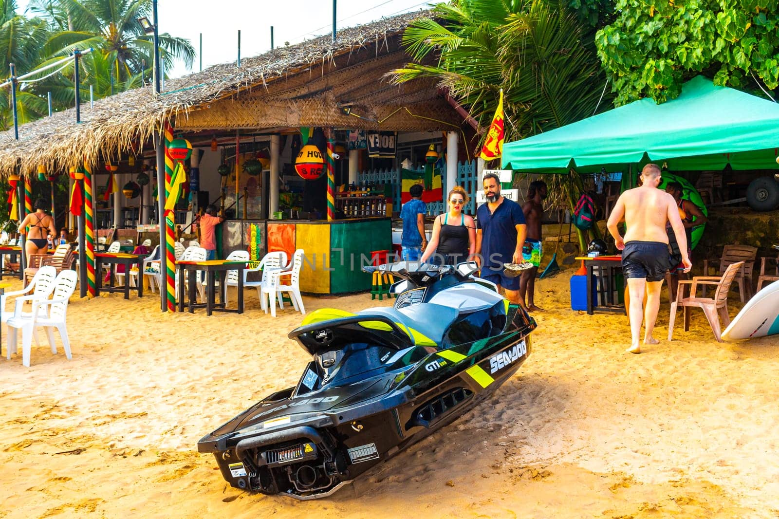 Jet ski enjoy water sports at Mirissa Beach in Sri Lanka. by Arkadij