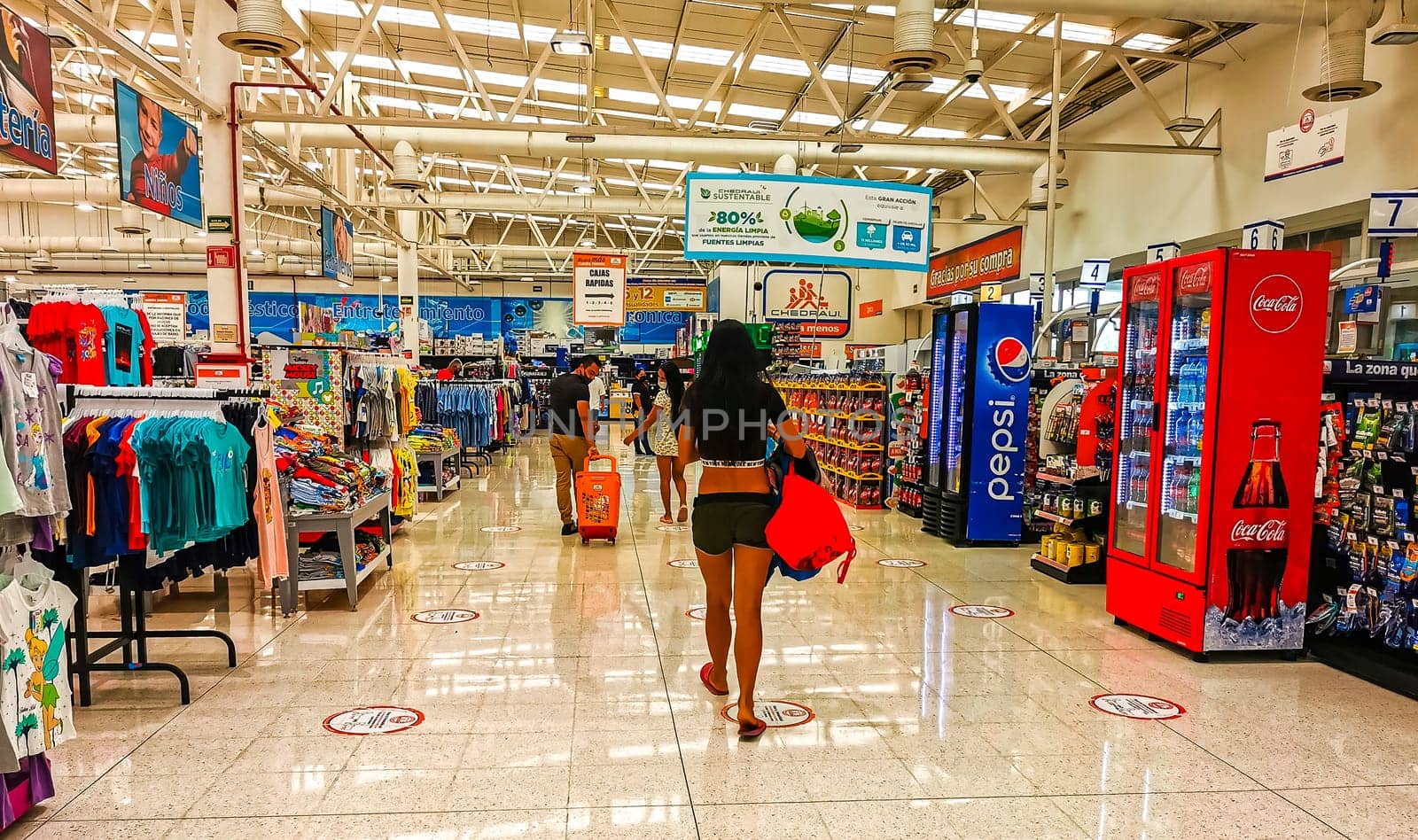 Supermarket from the inside Shelves Goods People Shopping carts Products. by Arkadij