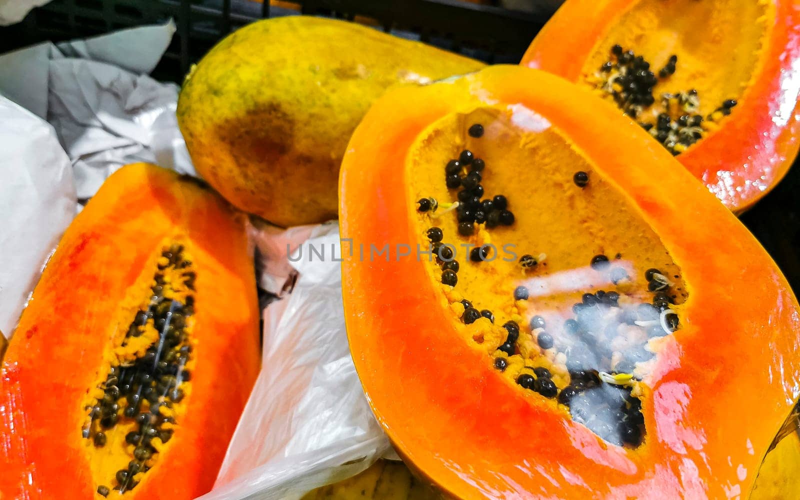 Wrapped packaged sliced papaya fruit in Playa del Carmen Quintana Roo Mexico.