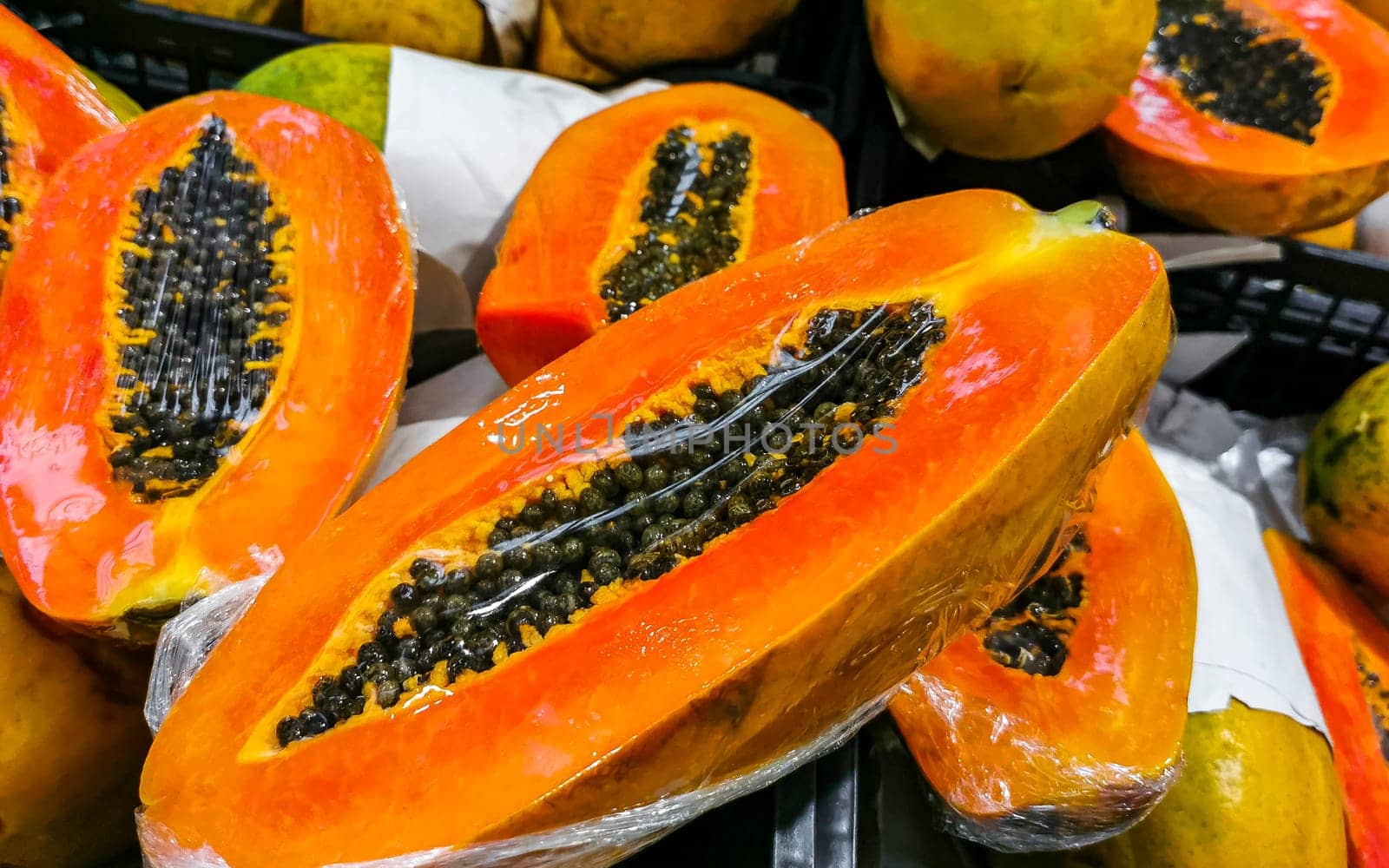 Wrapped packaged sliced papaya fruit in Playa del Carmen Quintana Roo Mexico.