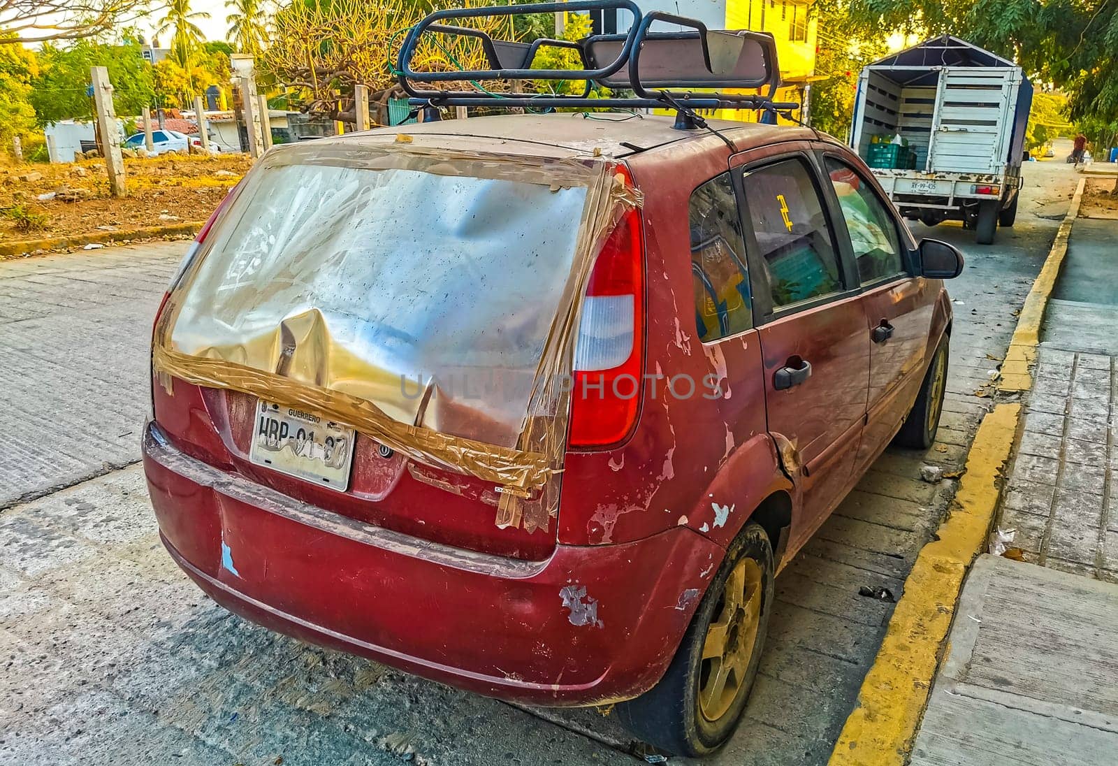 Red modern car vehicle transportation in the city town Mexico. by Arkadij