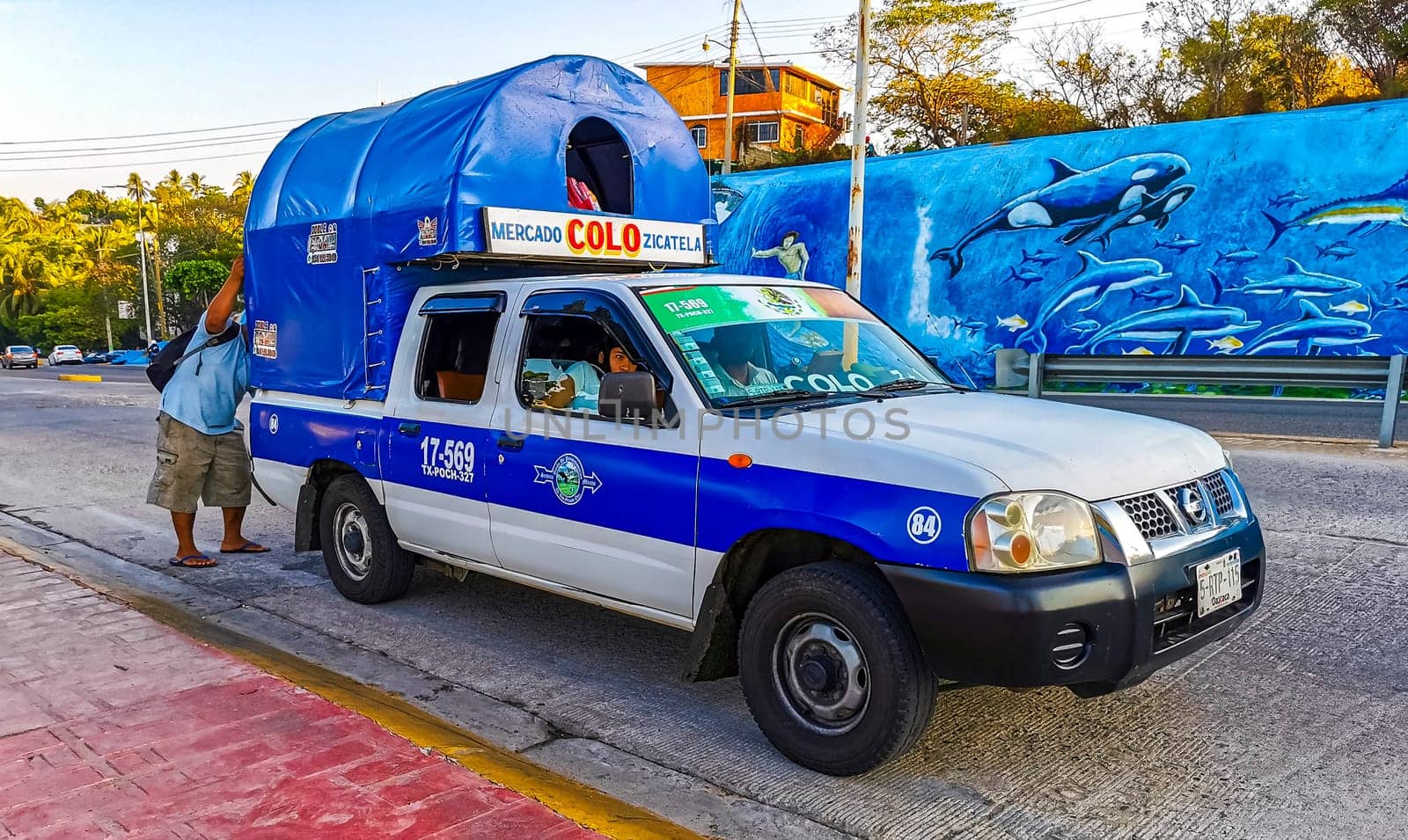 Mexican Colectivo van car transportation pickup truck bus in Mexico. by Arkadij