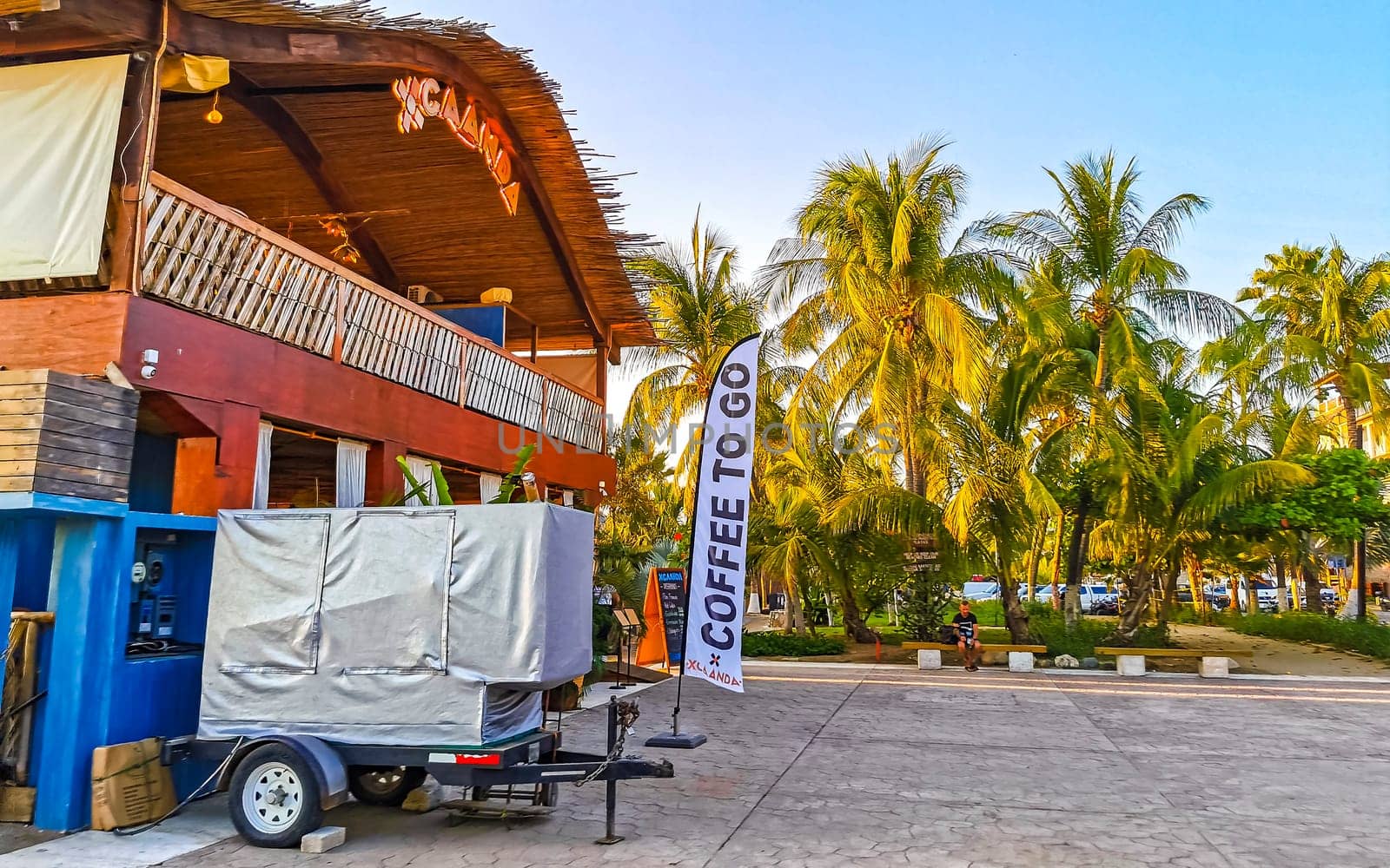 Restaurant restaurants bar bars shops hotels palms palm trees and promenades on the beach in Zicatela Puerto Escondido Oaxaca Mexico.