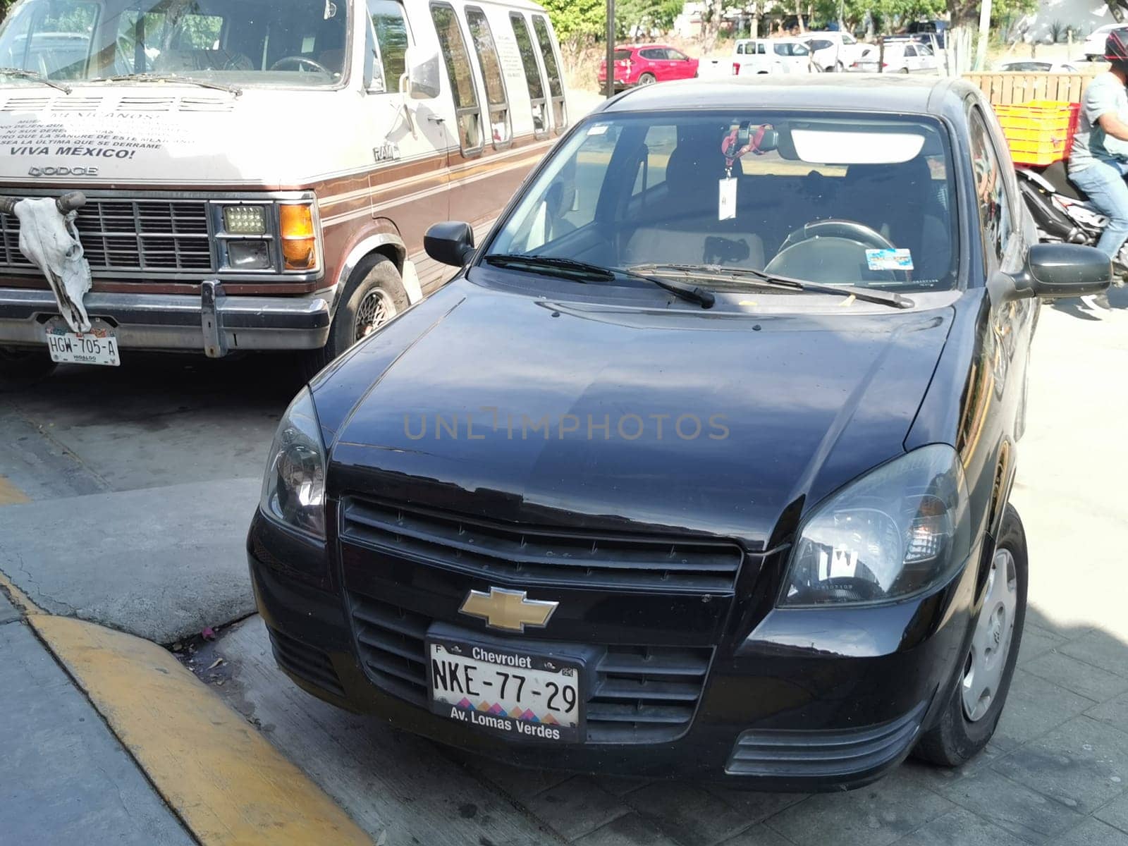 Dark black blue car vehicle transportation in the city town in Zicatela Puerto Escondido Oaxaca Mexico.
