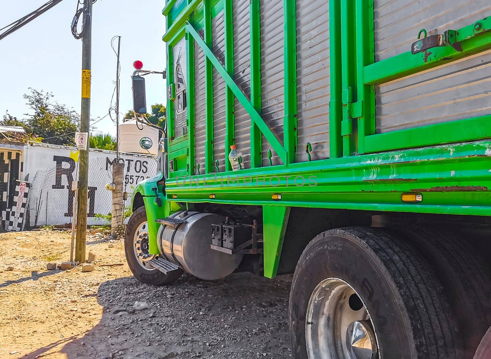 Mexican trucks cargo transporter delivery cars in Puerto Escondido Mexico. by Arkadij