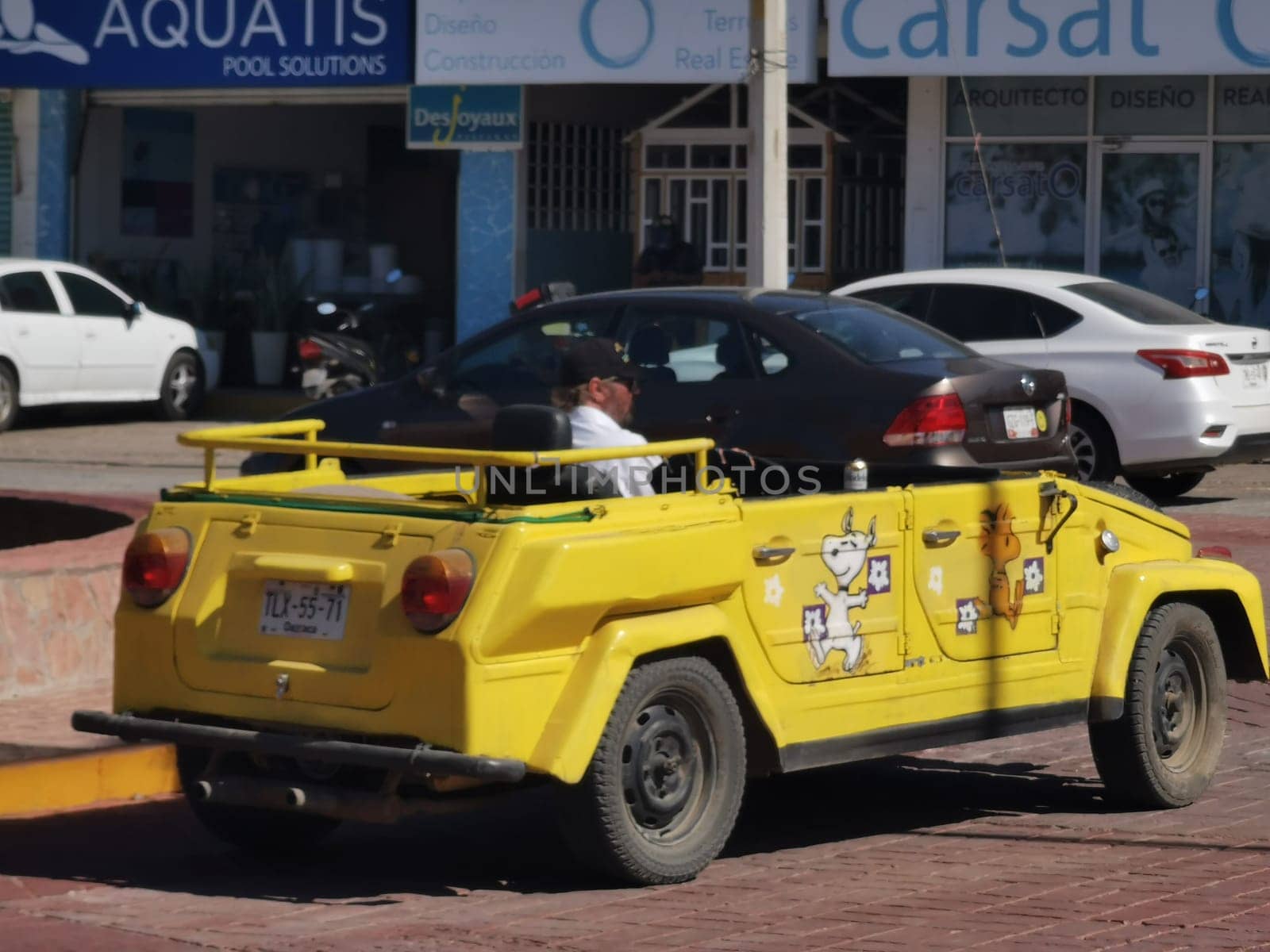 Yellow car vehicle transportation retro in city town Mexico. by Arkadij