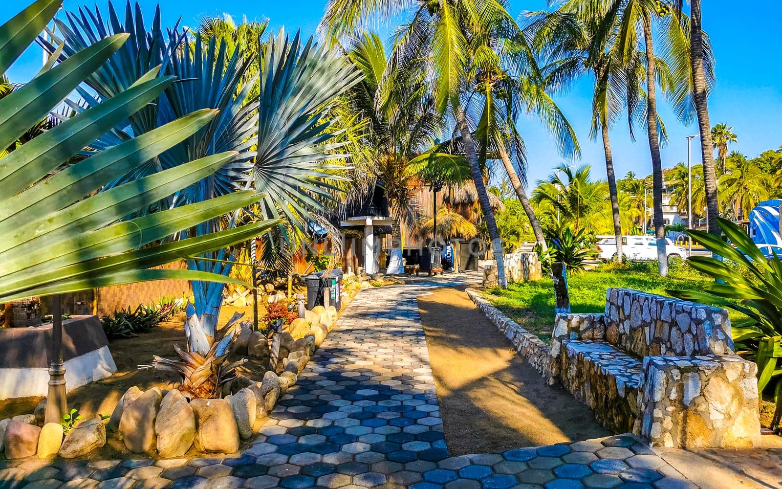 Restaurant restaurants bar bars shops hotels palms palm trees and promenades on the beach in Zicatela Puerto Escondido Oaxaca Mexico.