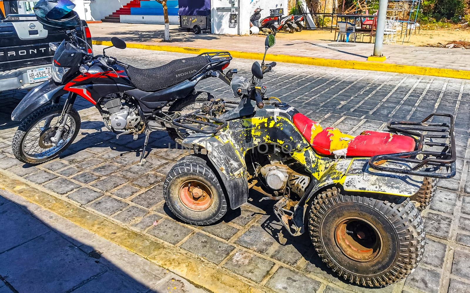 Quad bike bikes atv scooters motorcycles motorbikes outdoor in Zicatela Puerto Escondido Oaxaca Mexico.