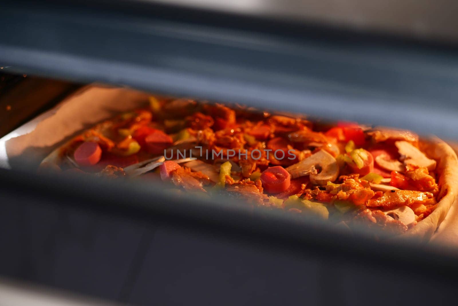 Homemade pizza is baked in a modern electric oven