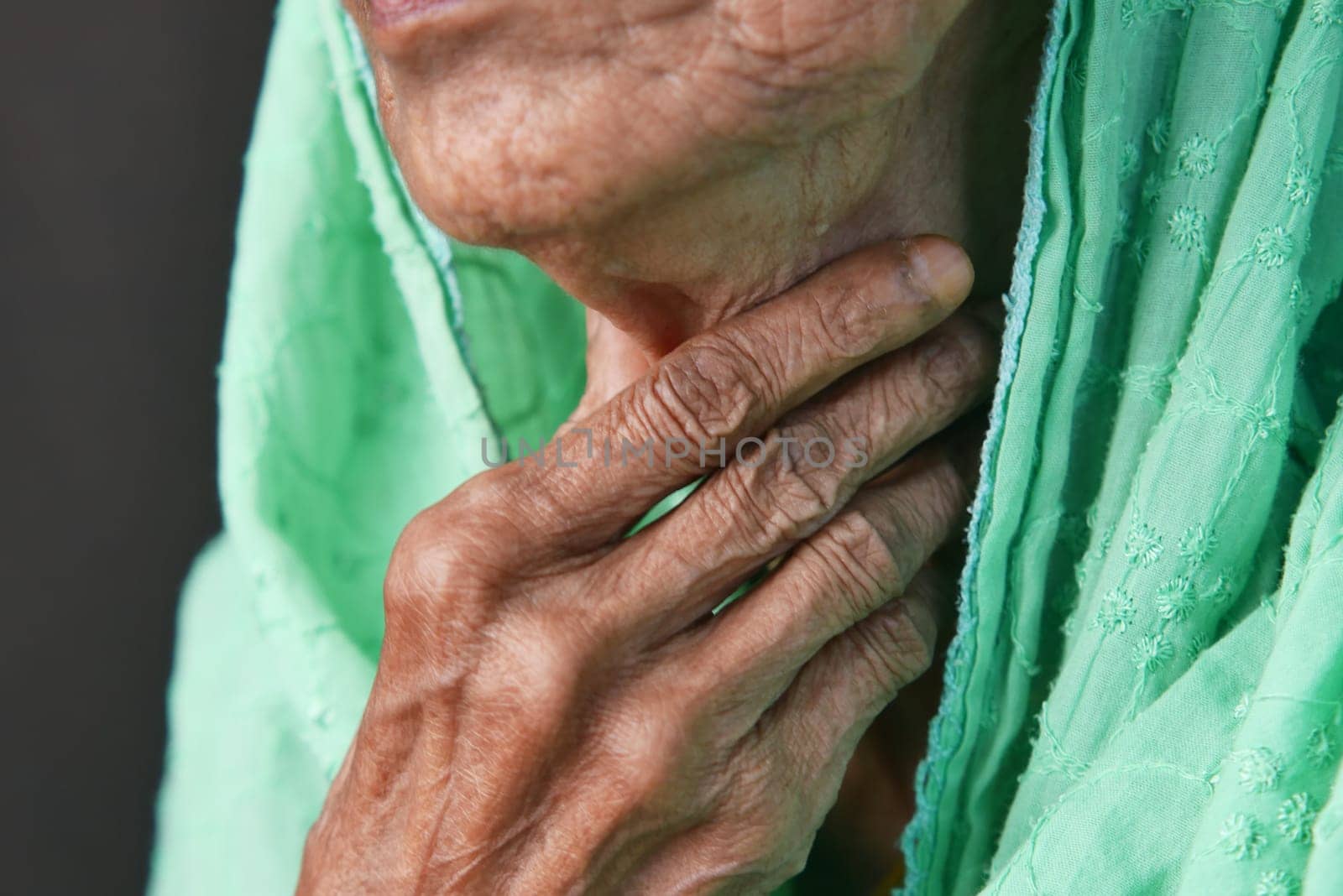 senior woman suffering throat pain close up ,