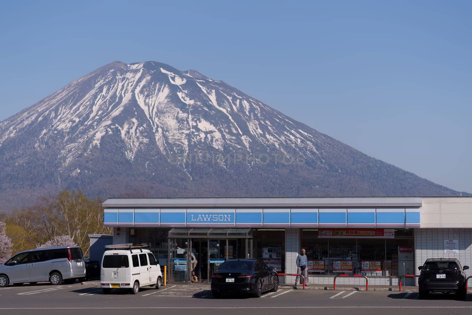 Hokkaido - Sapporo, Japan - May 01 20204 - Lawson with Mountain in the background.