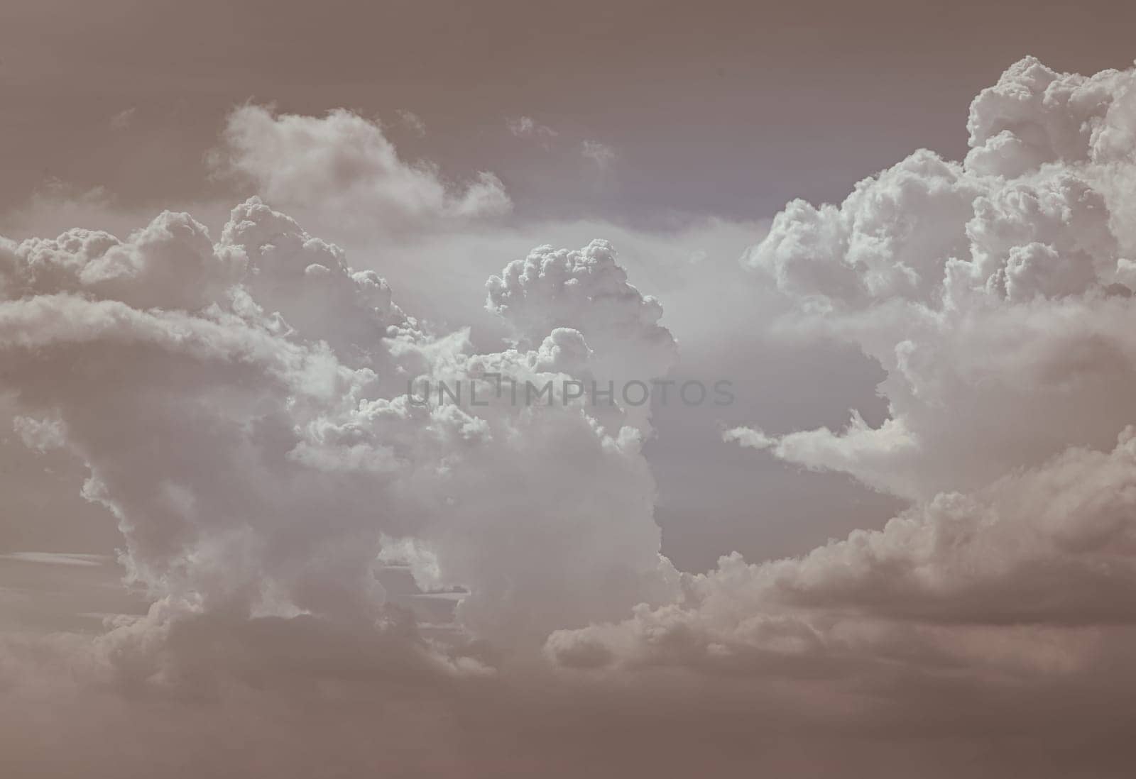 The sky is being covered with fluffy white clouds. Concept idea of Imaginative clouds nature, Amazing sky like a heaven for background wallpaper and texture, Space for text, Selective Focus.