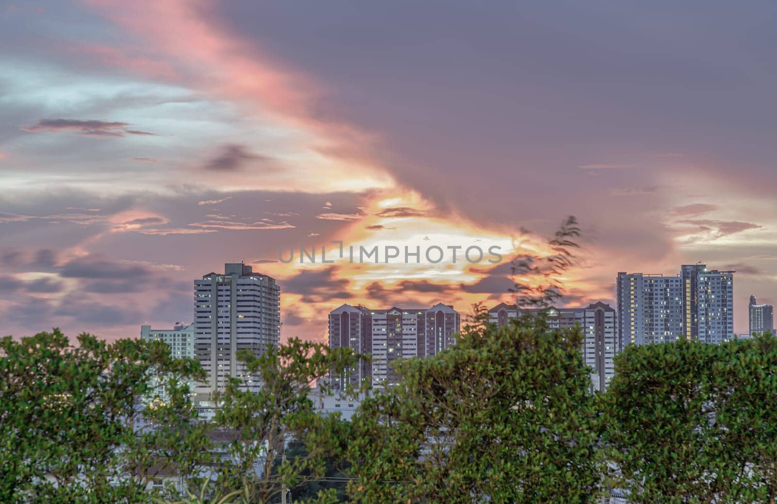 Bangkok, Thailand - May 20, 2024 - Gorgeous scenic of sunset with beautiful cloud and sky over metropolitan city. Bangkok city skyscrapers after sunset with Beautiful sky background, They can be used as Wallpaper, Copy space, Selective Focus.