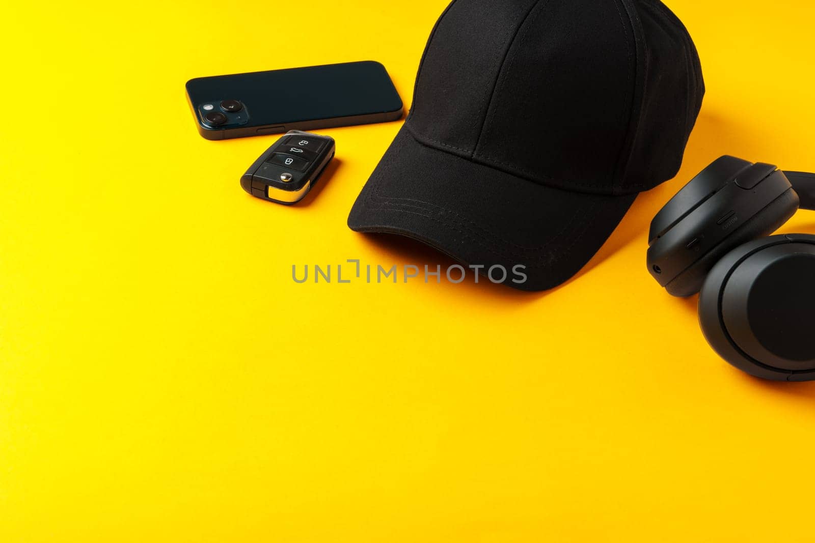 Baseball hat against yellow background in studio close up