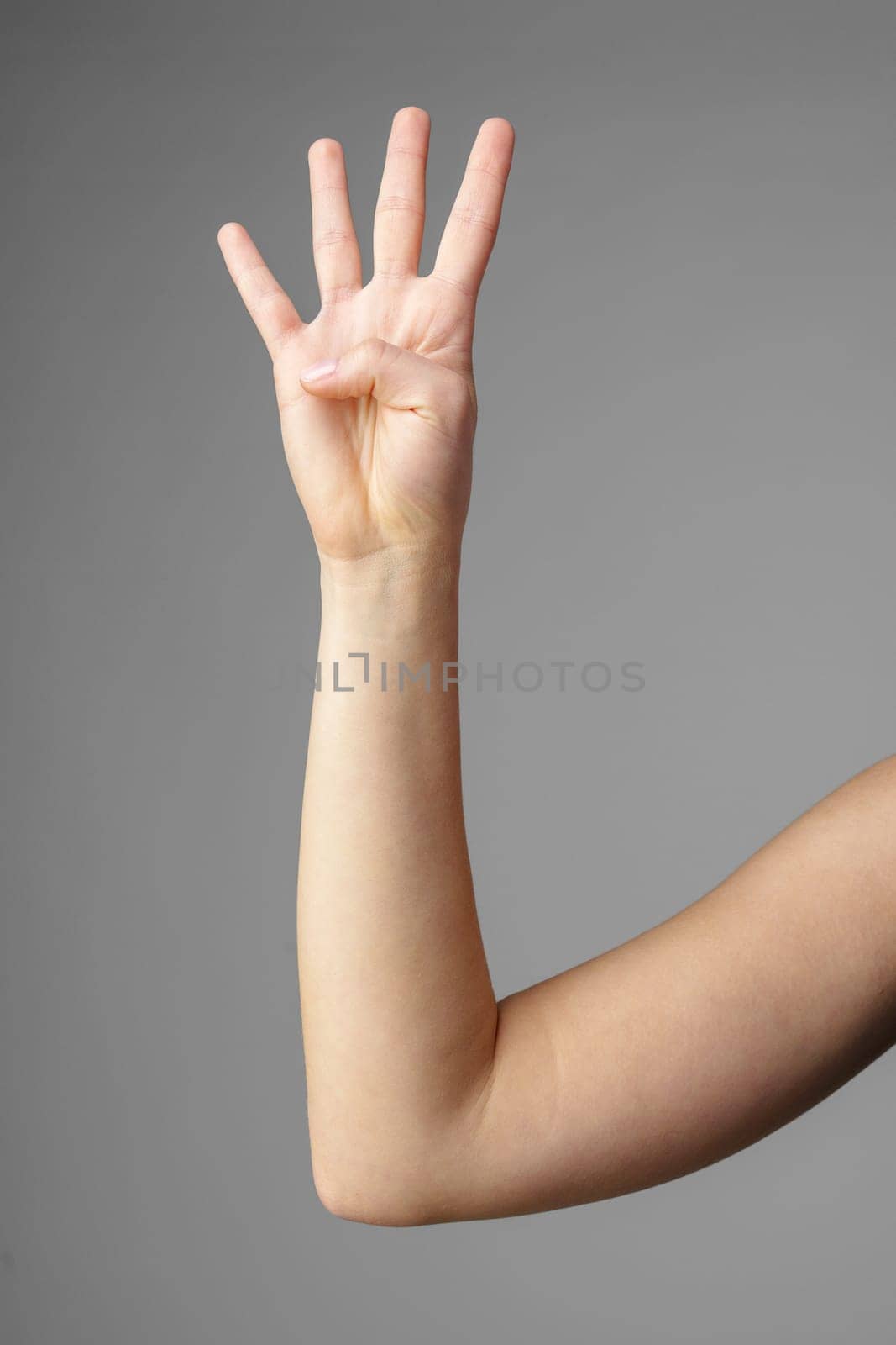 Woman Holding Arm Up in the Air with Gesture close up