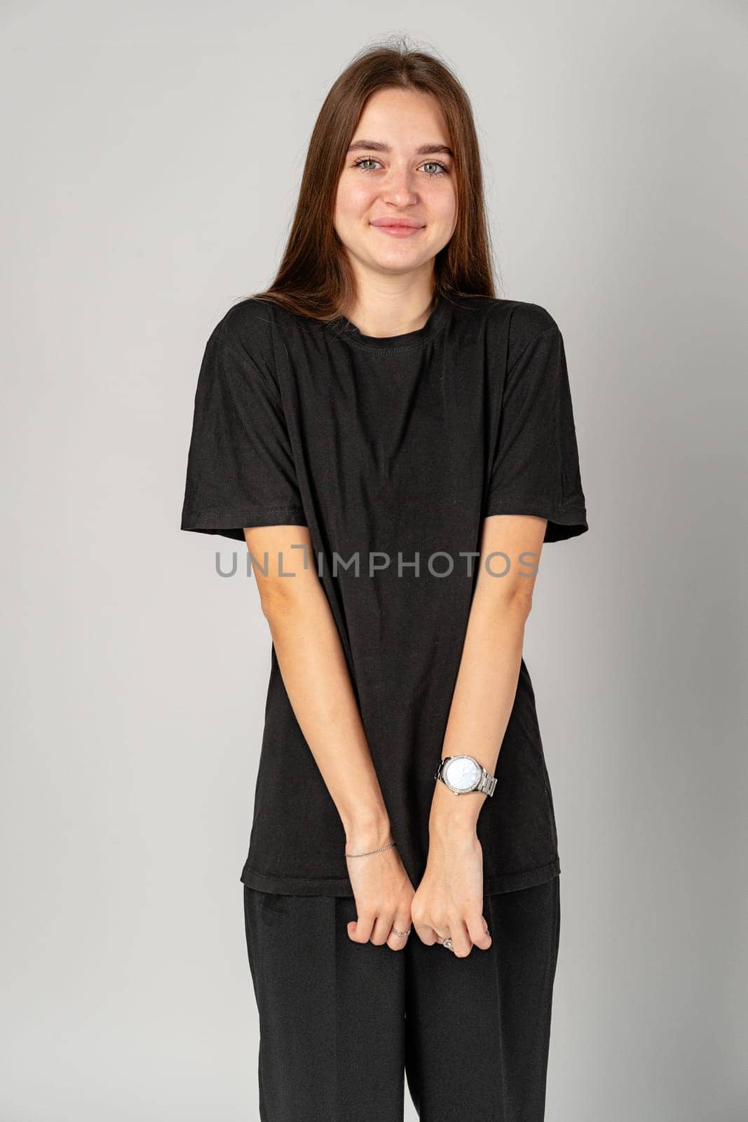 Young Woman in Black Shirt and Black Pants in Studio close up