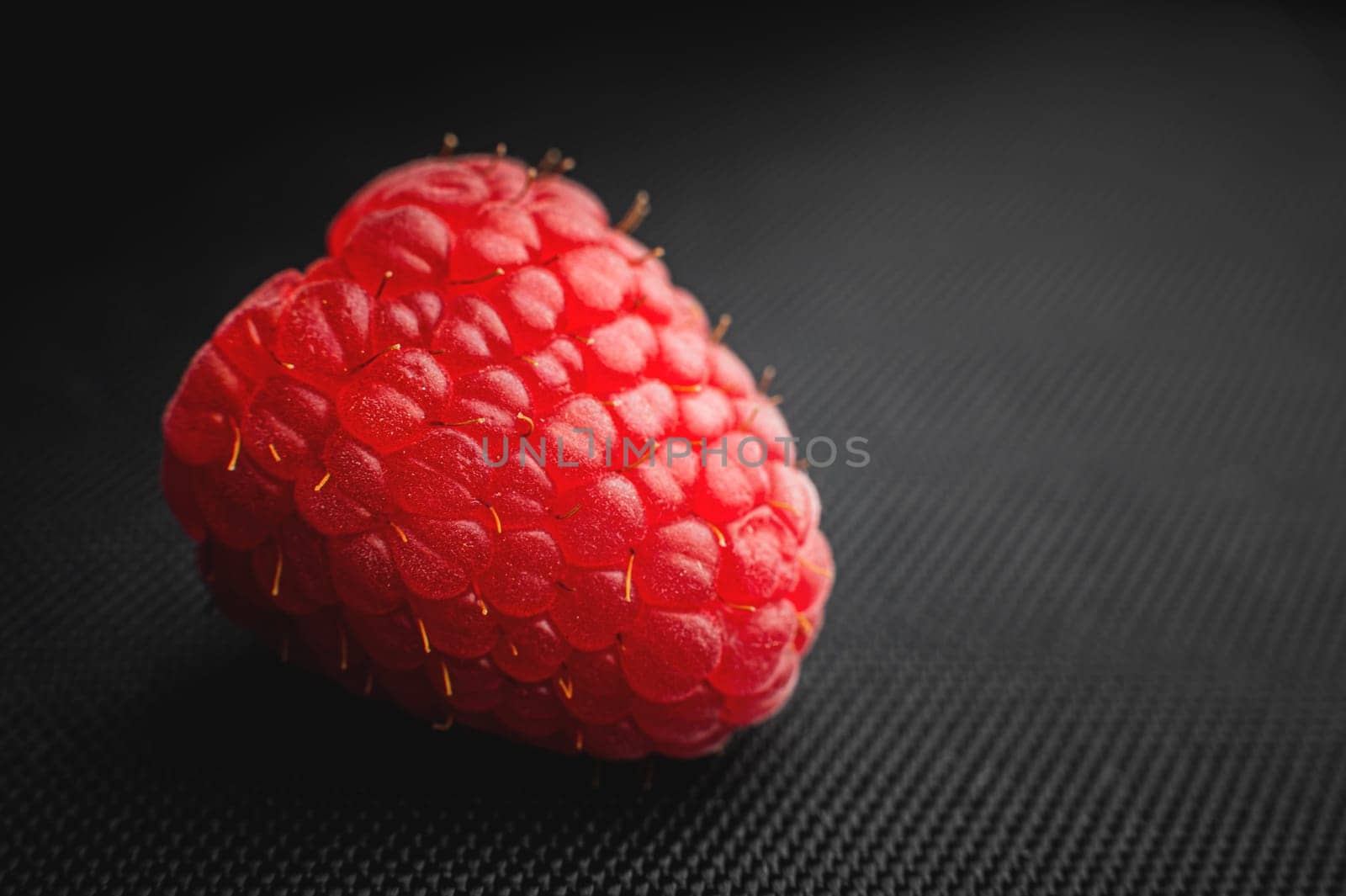 Close up, fresh and ripe red raspberries. Pink raspberry macro shot by yanik88