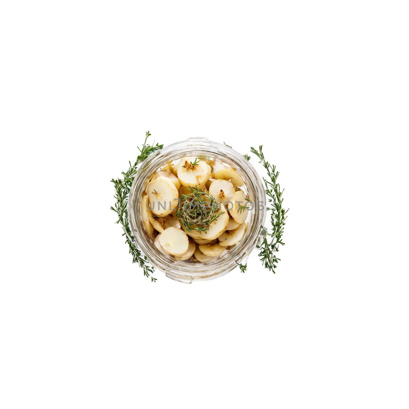 Pickled sunchokes crisp and earthy fanning out of a jar with thyme sprigs and garlic. Food isolated on transparent background.