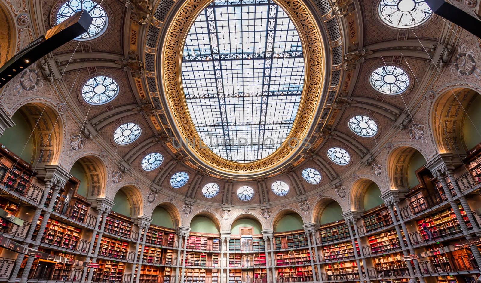 PARIS, FRANCE, OCTOBER 20, 2022 : Oval reading room in National Library, Richelieu site, Paris, france, built by architects Jean-Louis Pascal. and Alfred Recoura, from year 1897 to year 1932