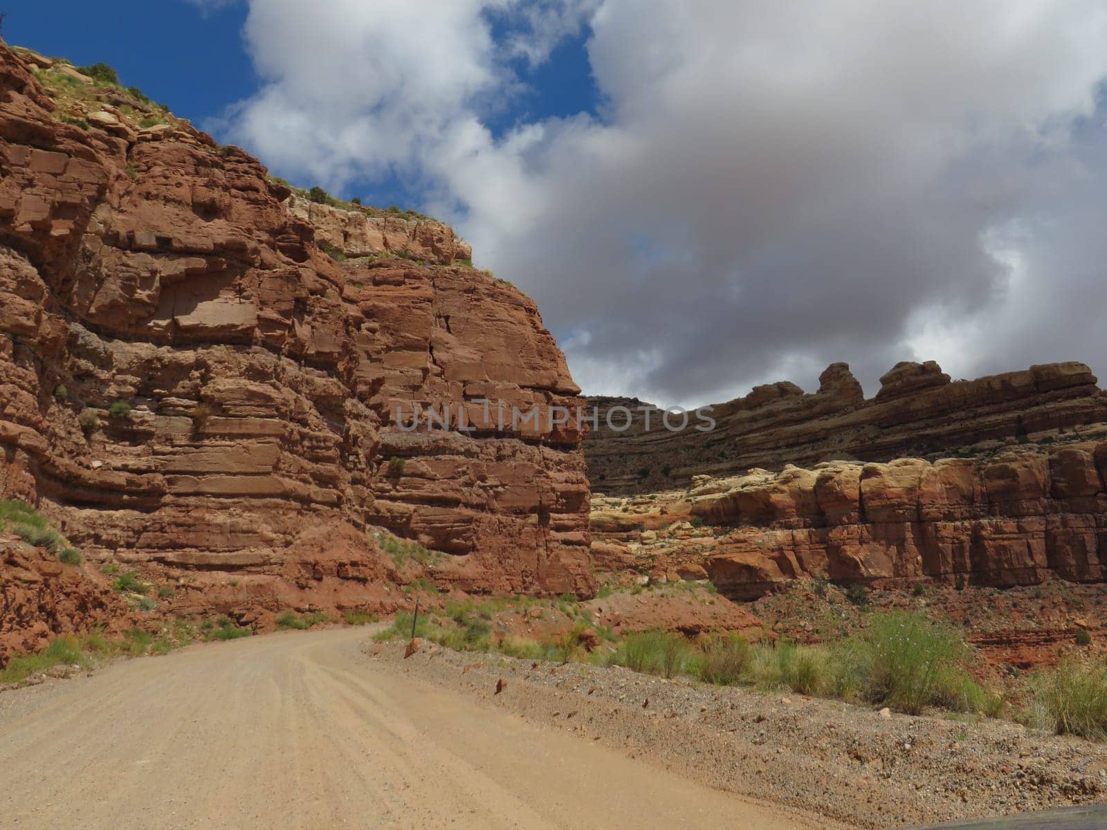 Single Lane Dirt Road in Red Rock Country, Moki Dugway in Utah, Highway 261. Storm clouds forming overhead. High quality photo