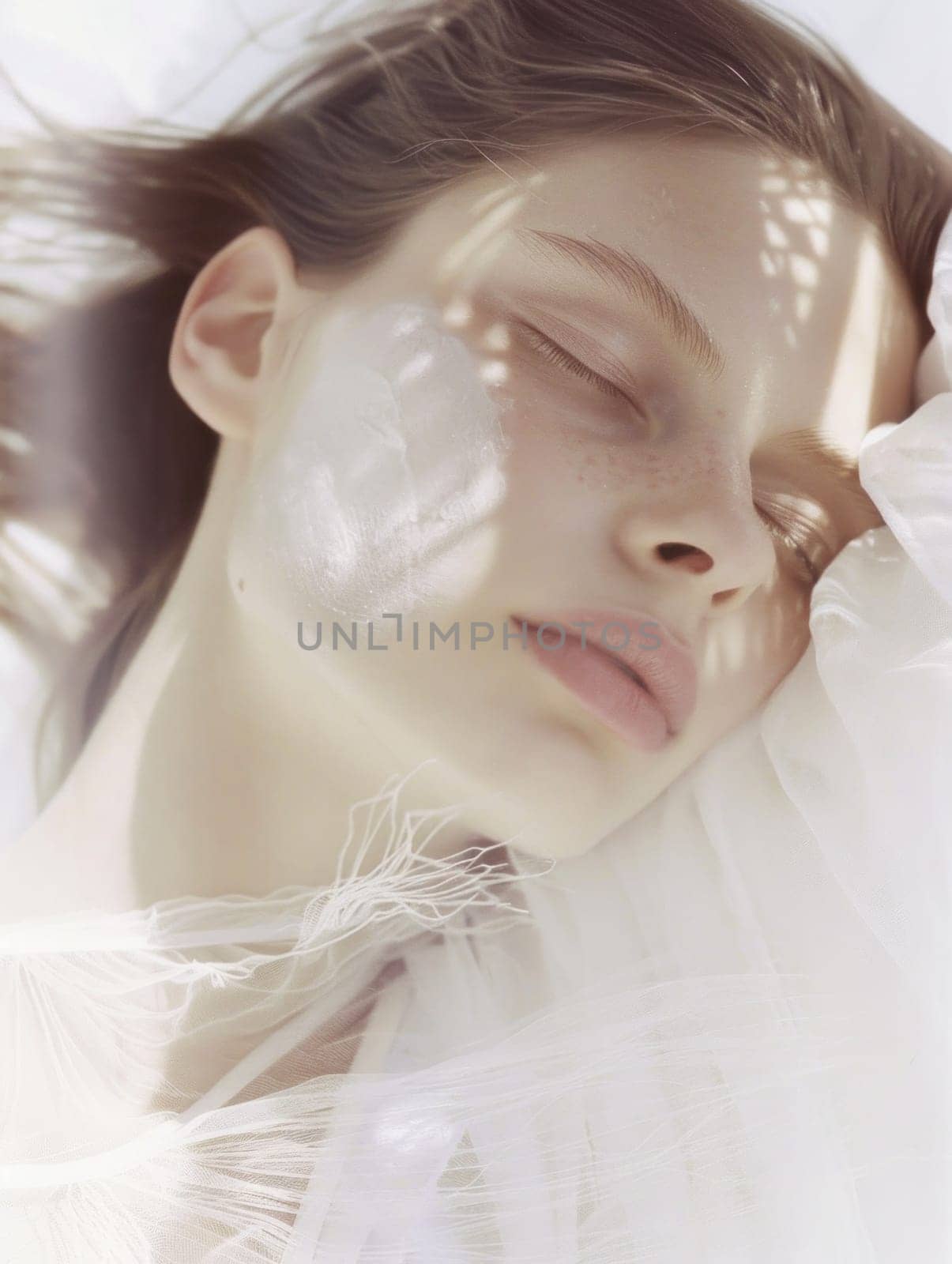 Peaceful woman sleeping comfortably under white sheet in relaxing atmosphere for health and wellness concepts