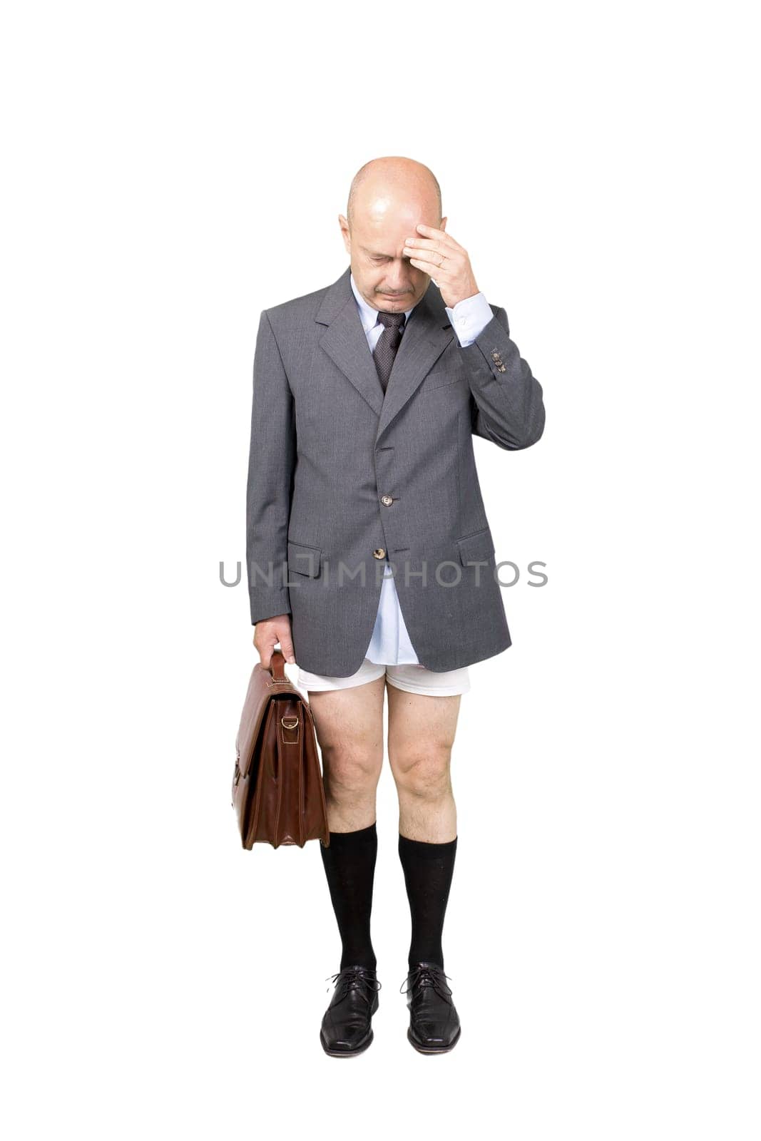 a worried businessman in underpants