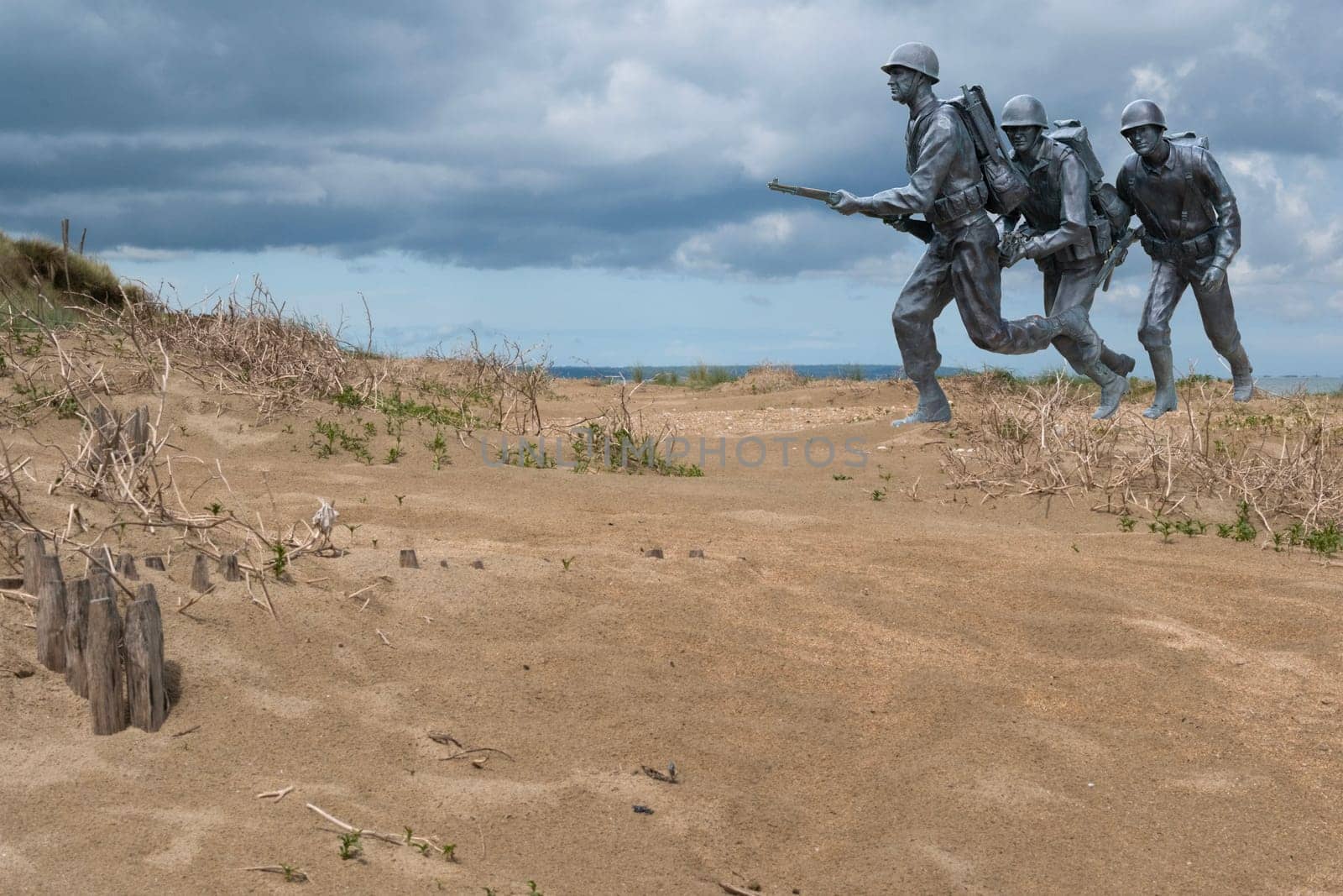 Normandy France D-Day soldiers sculptures photomontage at WWII Utah Beach. Veterans Day rememberance. High quality photomontage