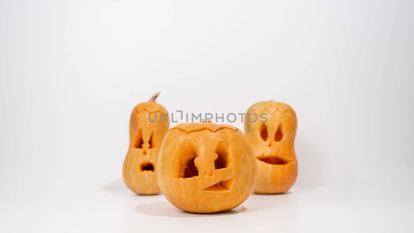 Three jack-o-lantern on a white background. Halloween decoration