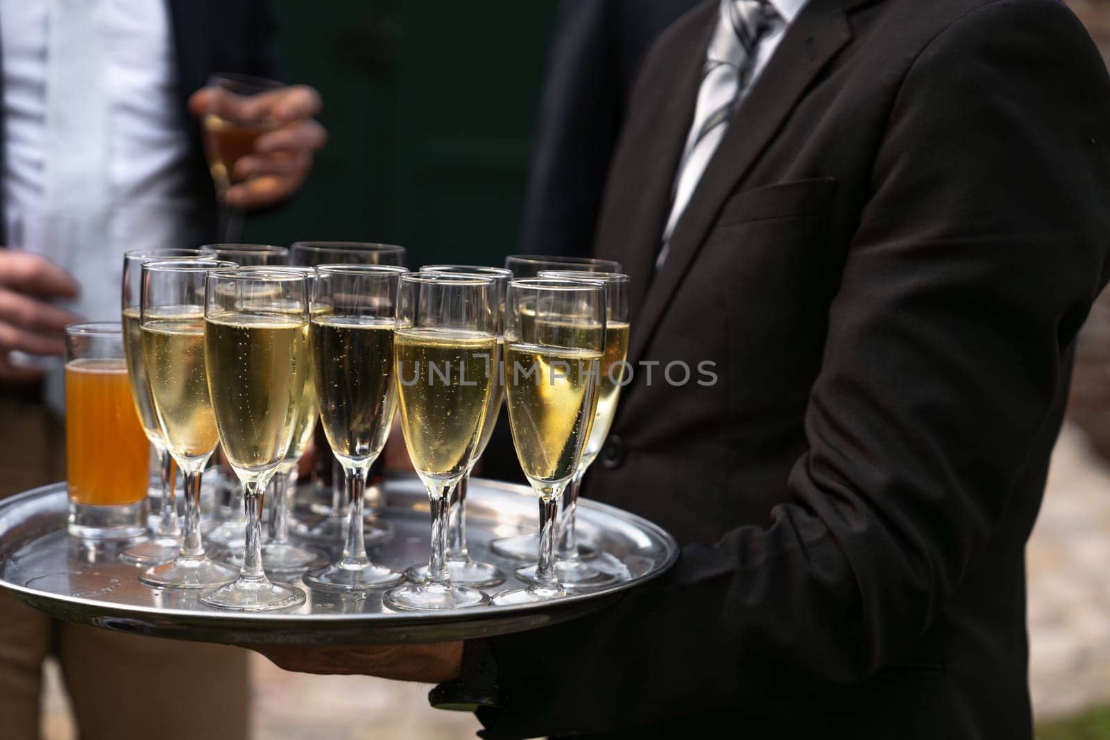 Waiter serving champagne at a wedding