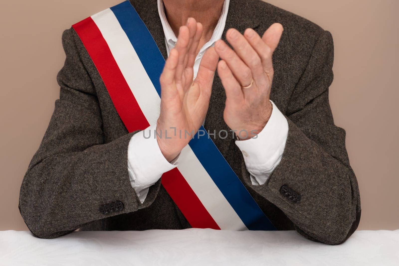 Mayor in France congratulates newlyweds French red blue white ribbon