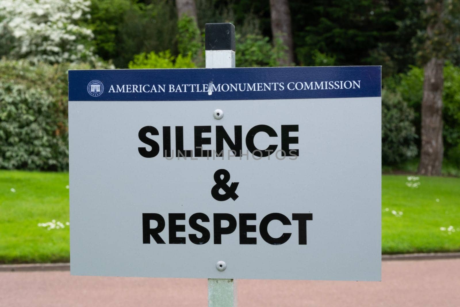 Courtesy sign at American cemetery at Normandy area. WWII memorial. High quality photo