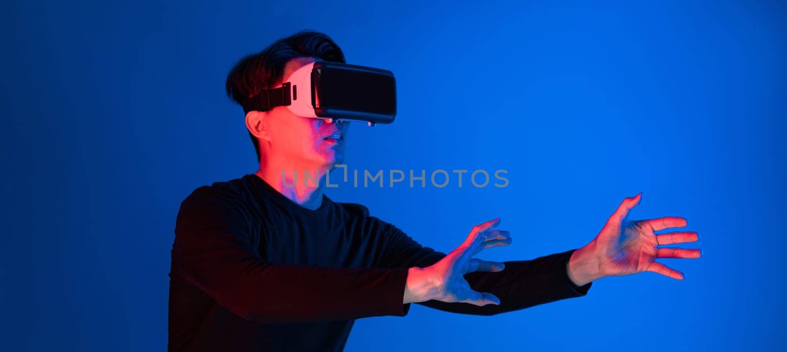 Asian athlete with VR holding a basketball player exploring virtual space on neon portrait sports training connecting digital futuristic hologram technology metaverse world playing court. Contrivance.