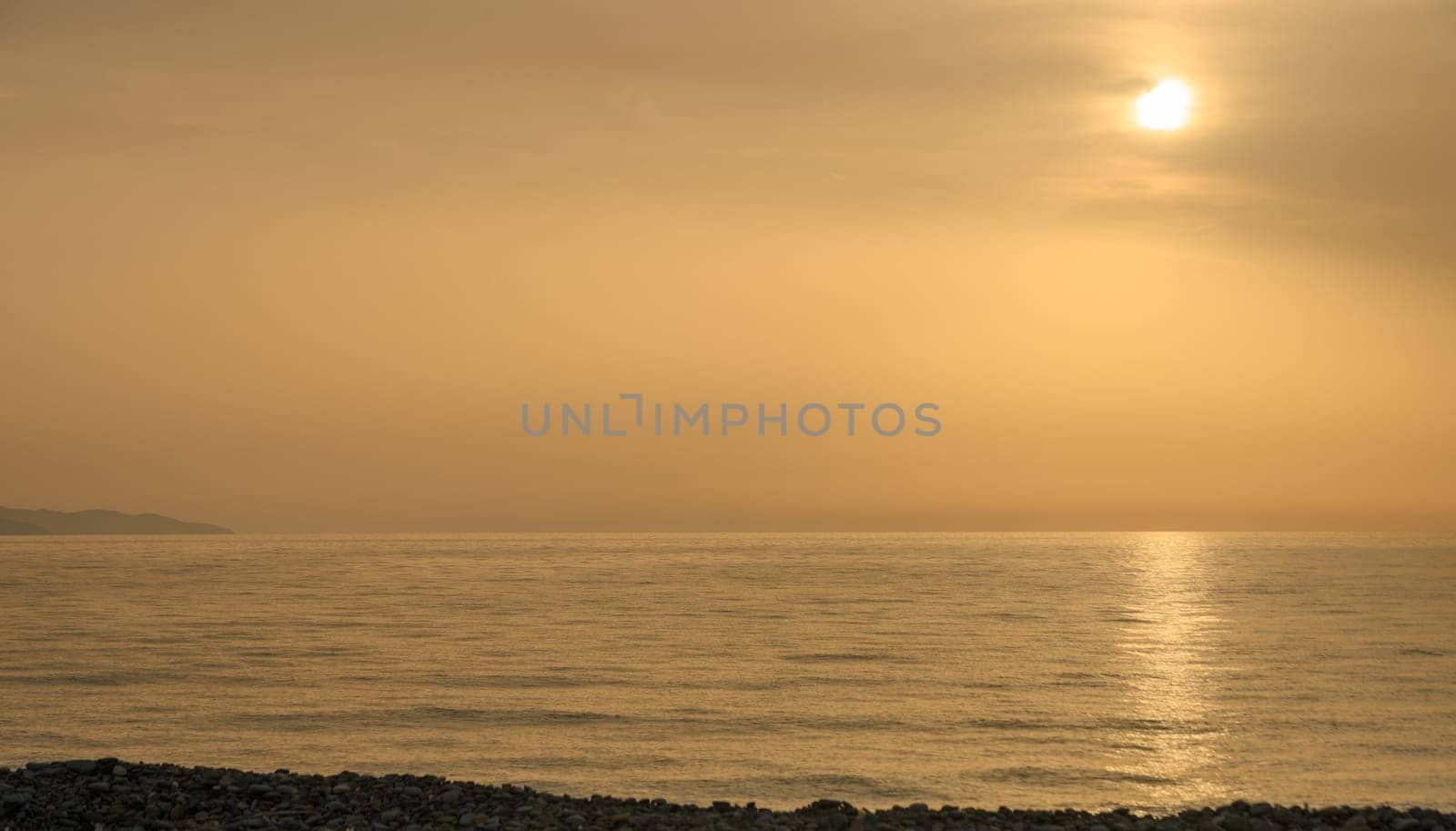 Golden hour shot of the sun setting over the Mediterranean Sea 1