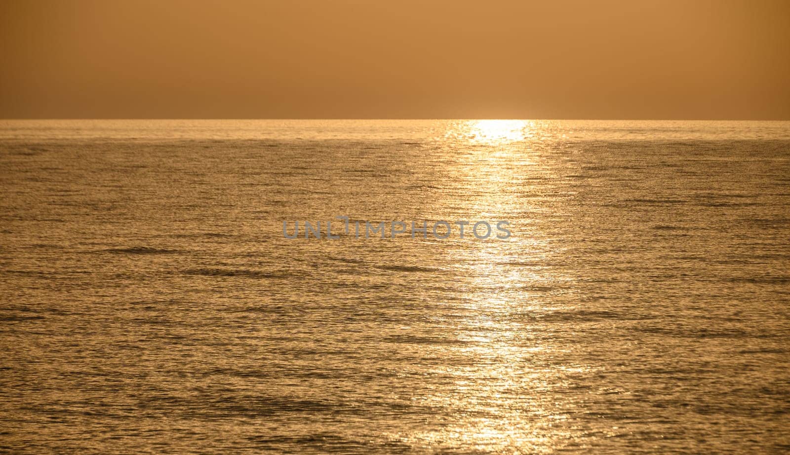 Golden hour shot of the sun setting over the Mediterranean Sea by Mixa74