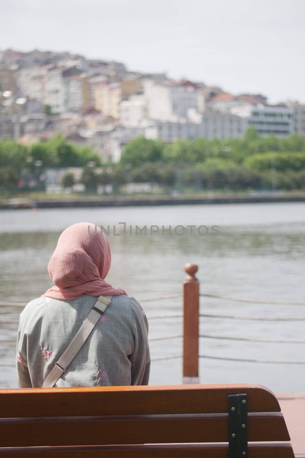 Unhappy girl sitting at bench