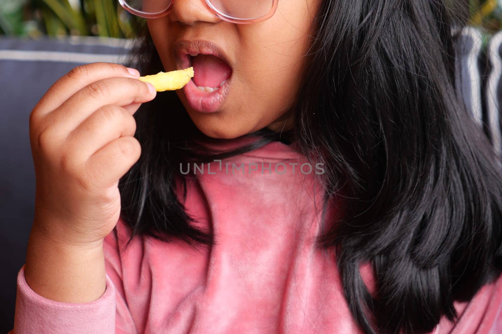 child eating french fries close up ,