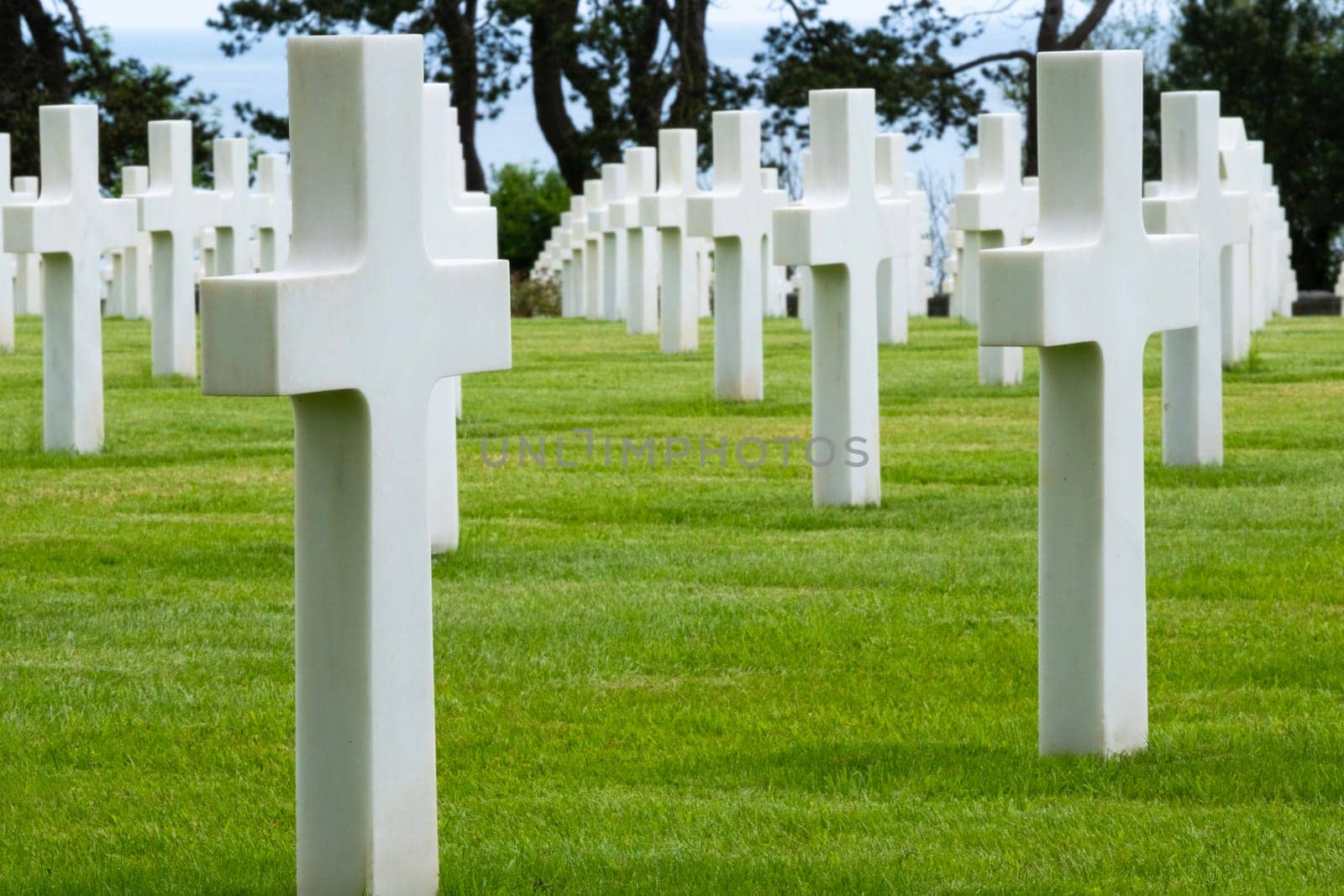 American cemetery at Normandy area. WWII memorial. Close and down line of grave stones. High quality photo