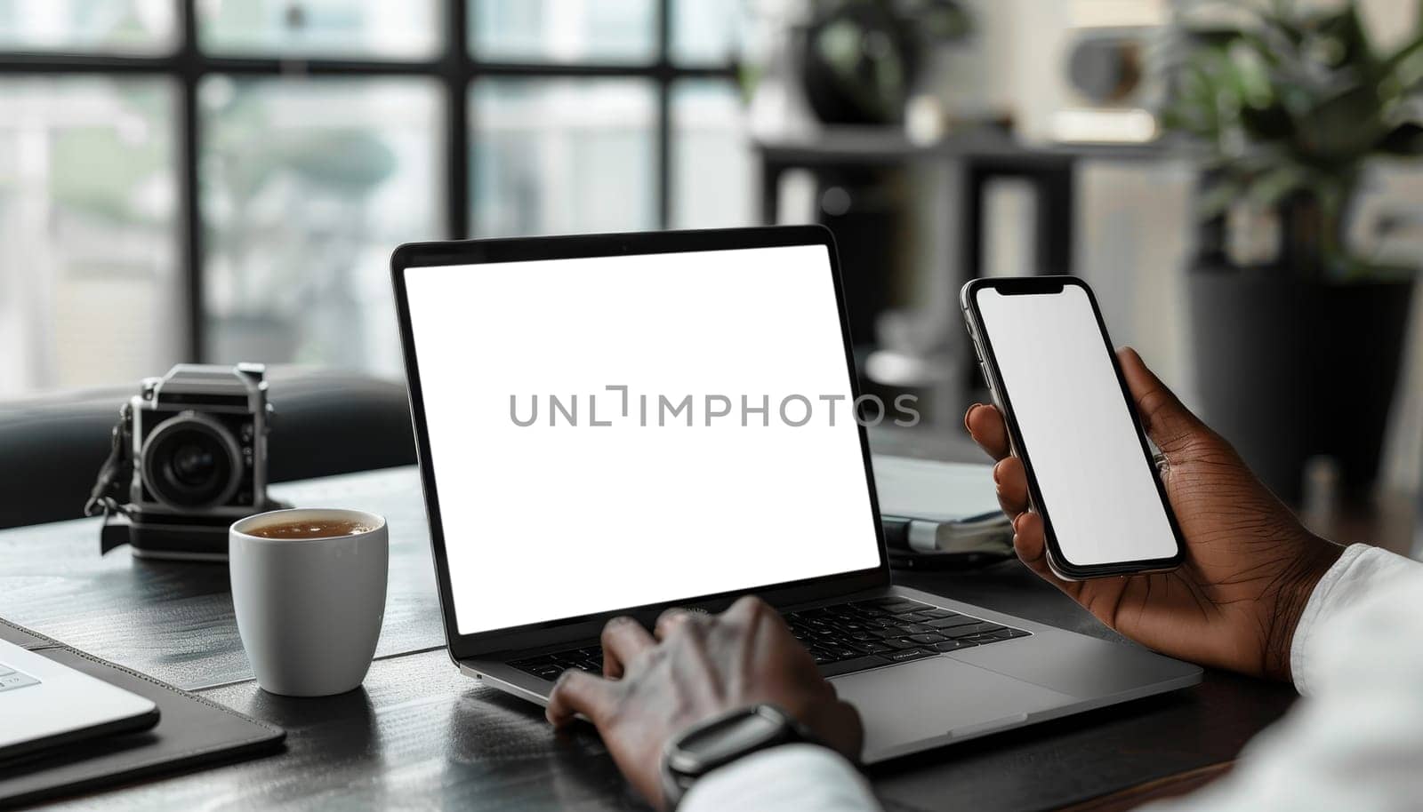 A person is holding a cell phone and a laptop computer by AI generated image.