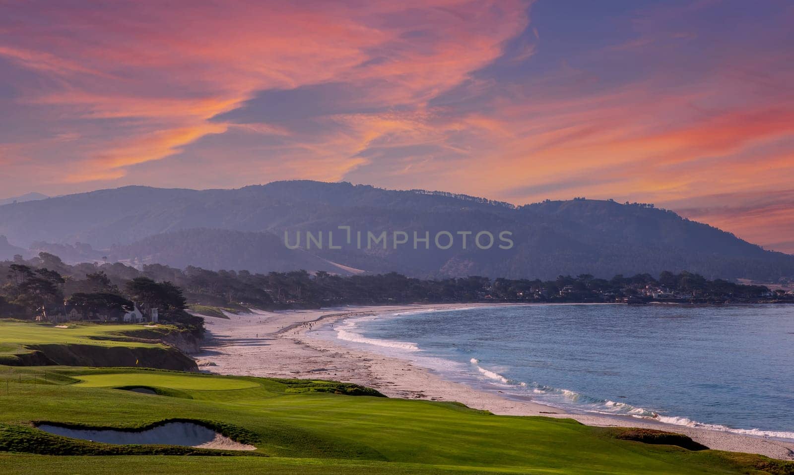 oceanside golf course with bunker,  ocean and clouds