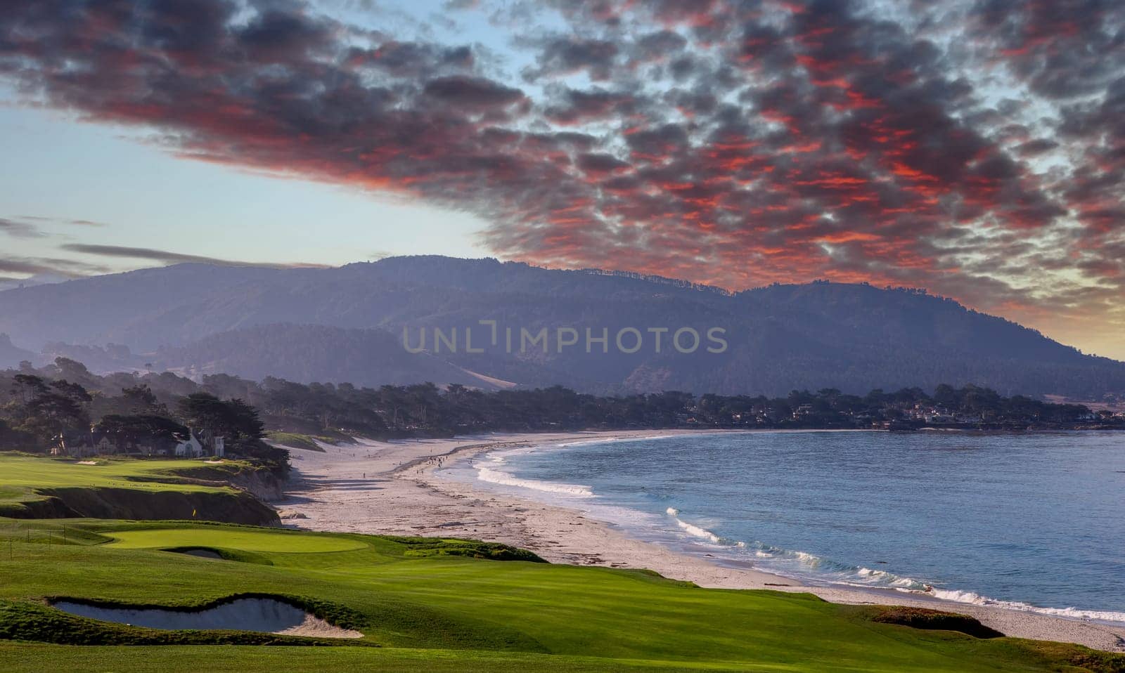 oceanside golf course with bunker,  ocean and clouds