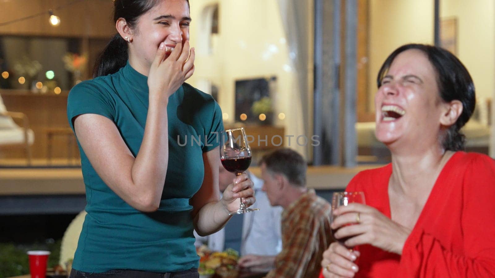 Family gather celebrate holiday. Mother and grandmother drink wine and talking at dinner party for celebration. Outdoor activity to spend time with polite relatives cross generation gap. Divergence.