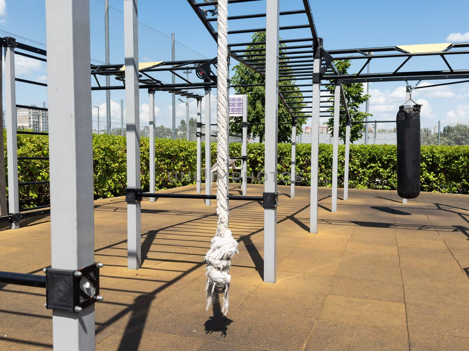 Close up of outdoor playground monkey bars on blue sky day with clouds. High quality photo