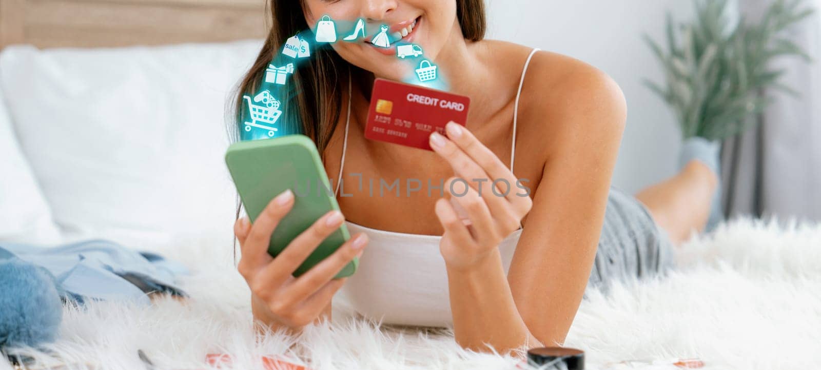 Elegant customer wearing white tank top holding credit card typing phone choosing online platform. Smart consumer opening e-commerce application use cashless technology shopping inventory. Cybercash.