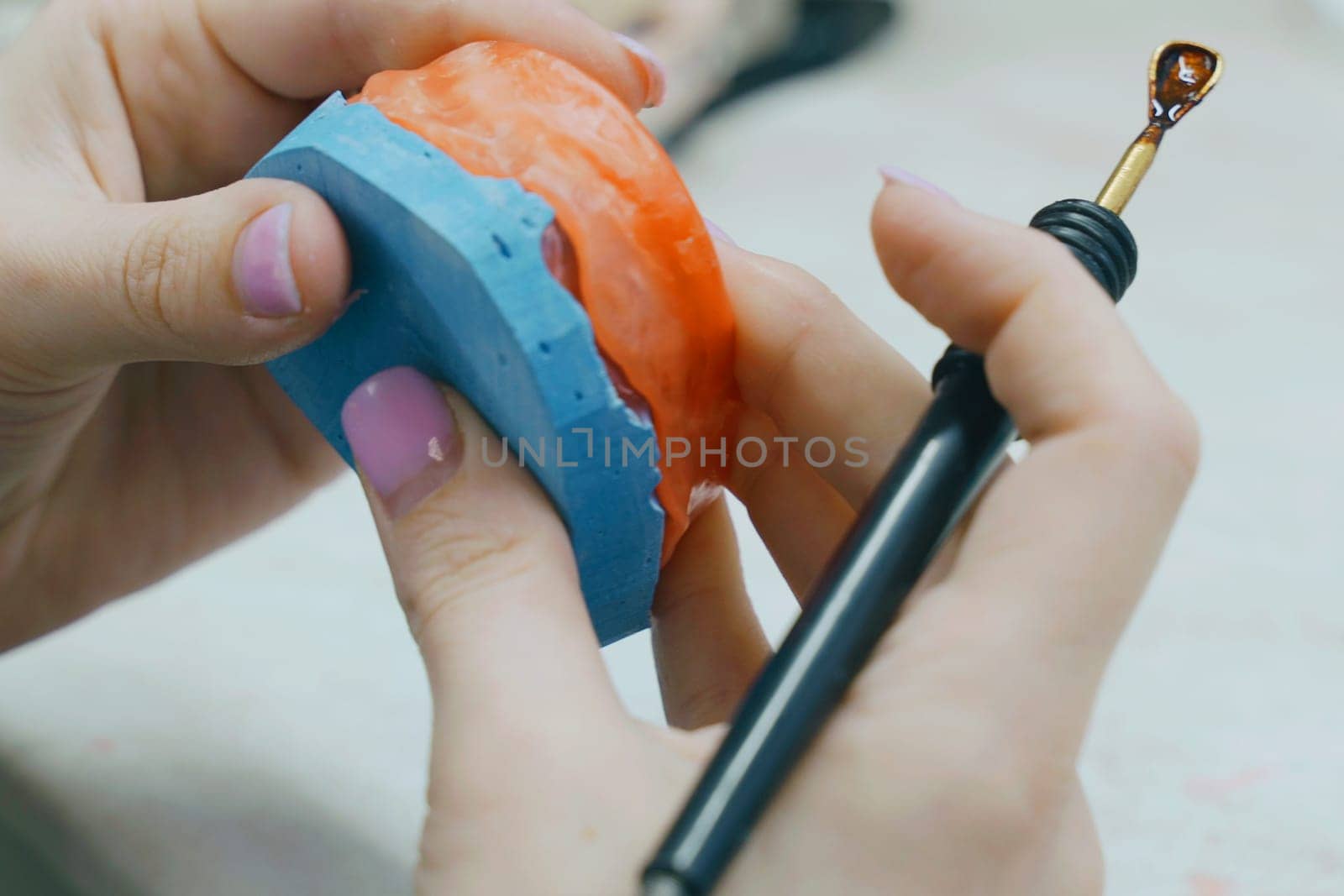 The dental technician makes a wax base and adds wax to form the mold. Dental concept